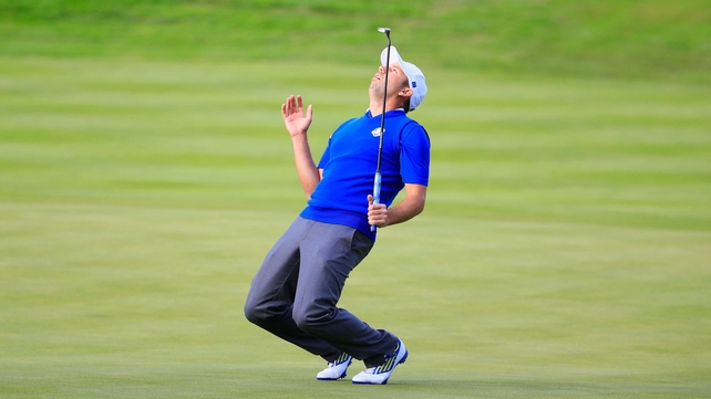 Sergio Garcia reacts to a putt on the 17th