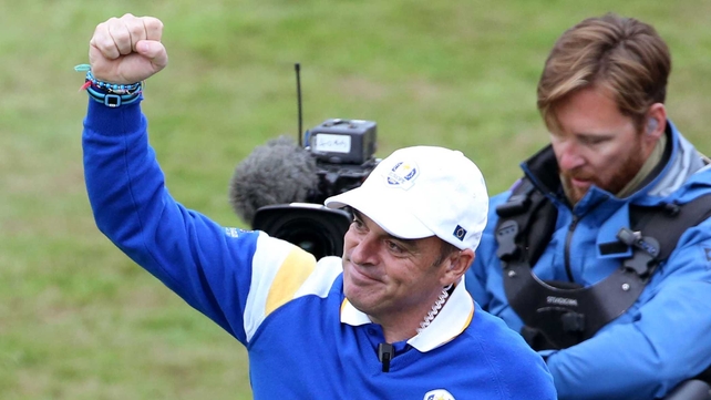Team Captain Paul McGinley celebrates after victory is assured...