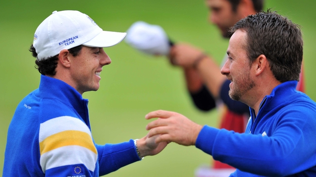 Graeme McDowell celebrates with Rory McIlroy after winning his match