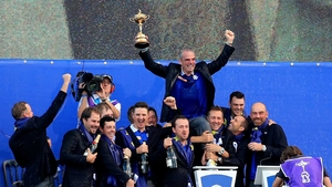 Europe team captain Paul McGinley celebrates is held aloft