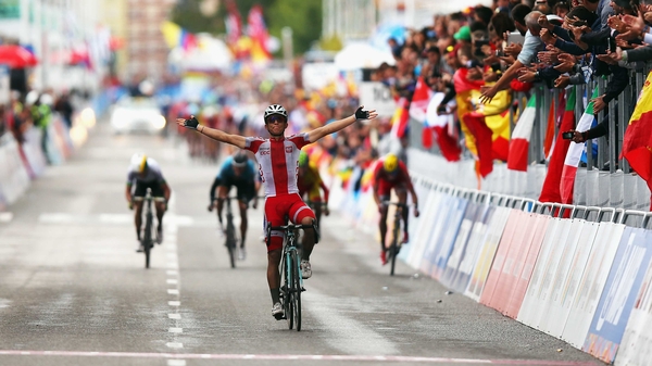 Michal Kwiatkowski celebrates his road race win