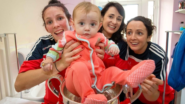 The victorious Cork team met 11-month-old Fay Kerrigan-Bell at Crumlin Hospital