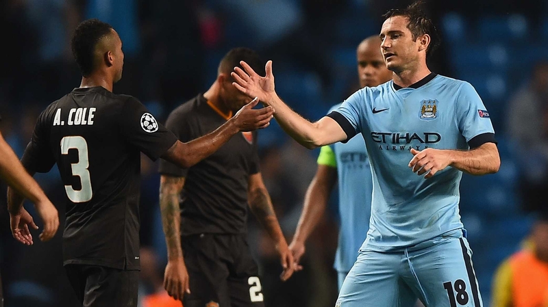 Former Chelsea team mates Ashley Cole and Frank Lampard greet each other afterwards