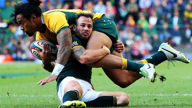 Joe Tomane of the Wallabies is tackled by South Africa's Francois Hougaard during their Rugby Championship clash in Cape Town