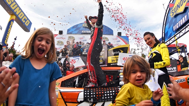 Jeff Gordon celebrates with his children Ella and Leo after winning the NASCAR Sprint Cup Series in Delaware