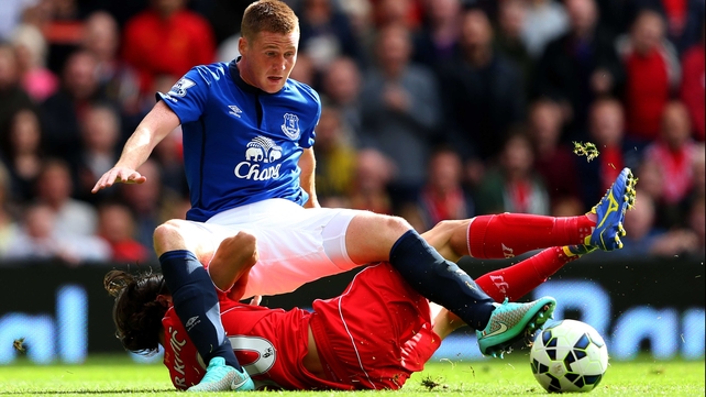 Ireland international James McCarthy rides a tackle during Everton's clash with Liverpool at Anfield