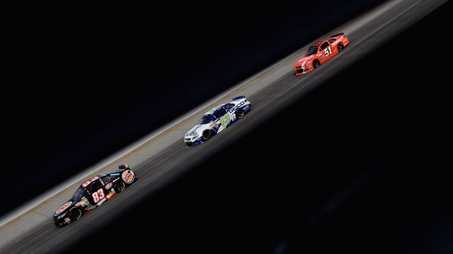 Competitors race during the NASCAR Sprint Cup Series at Dover International Speedway in Delaware