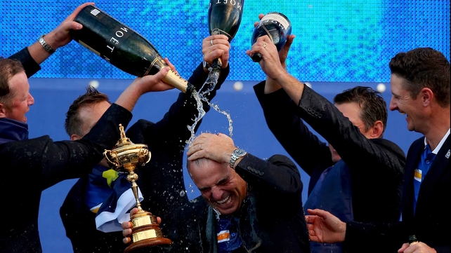 Europe captain Paul McGinley gets drenched by champagne after winning the Ryder Cup at Gleneagles in Scotland