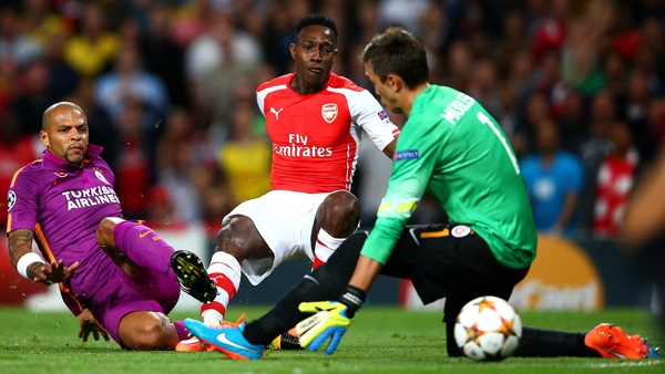 Arsenal's Danny Welbeck scores the opening goal past Galatasaray 'keeper Fernando Muslera