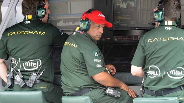 Caterham have initiated cost cutting measures since Tony Fernandes (C) sold the team in July