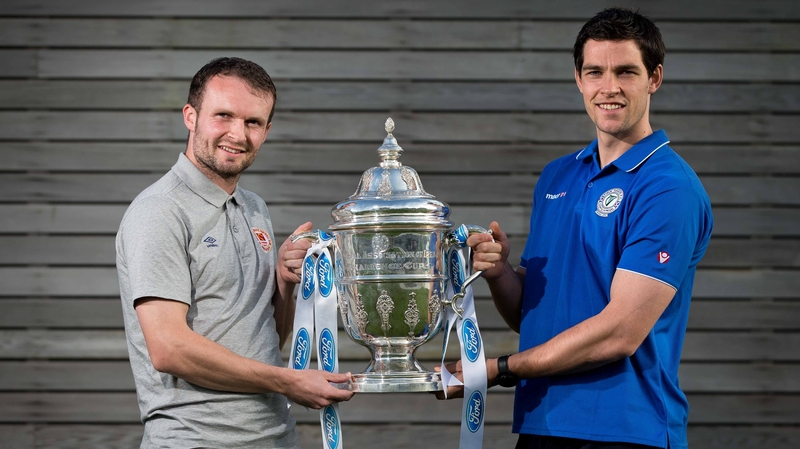 St Patricks Athletic's Conan Byrne and Packie Mailey of Finn Harps with the FAI Cup
