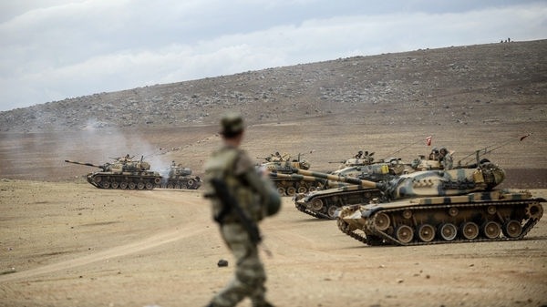 Turkish army tanks take position near the Syrian border last week