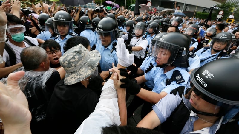 Scuffles break out between pro-democracy protesters and police in central Hong Kong