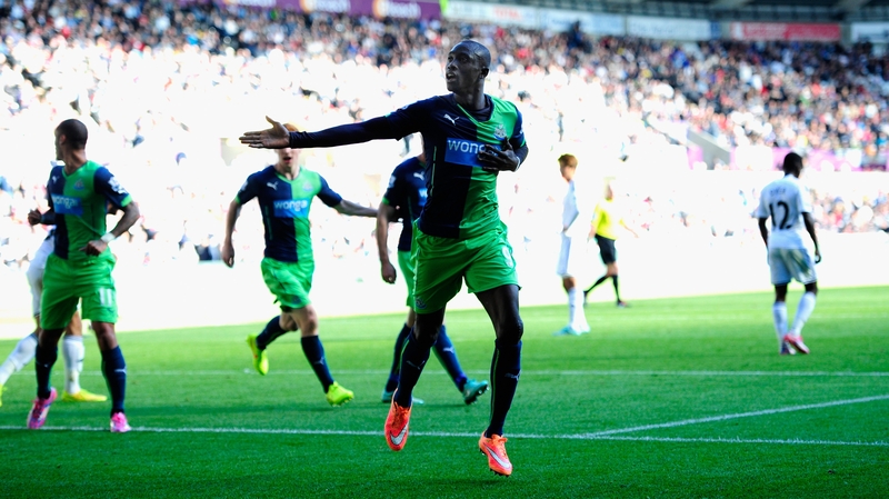 Papiss Cisse celebrates after scoring Newcastle's first goal