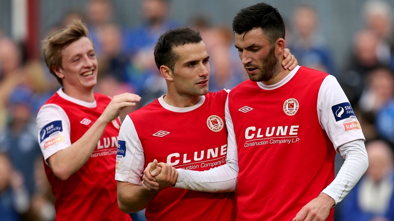 Chris Forrester and Christy Fagan are on hand to congratulate Killian Brennan who bagged a brace for the Inchicore side