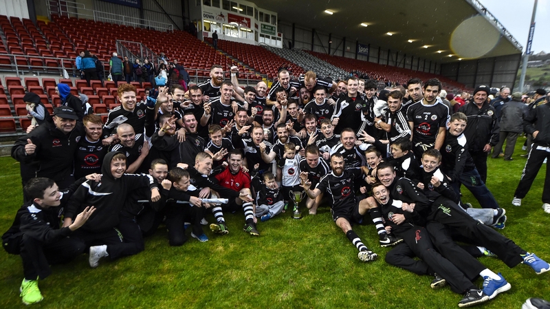 Kilcoo players and officials celebrate a hat-trick of county titles