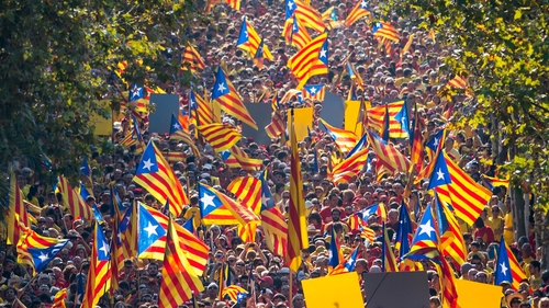Demonstrators wave Catalan flags during an independence demonstration