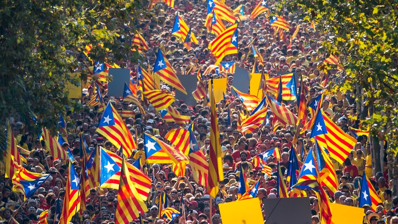 Demonstrators wave Catalan flags during an independence demonstration