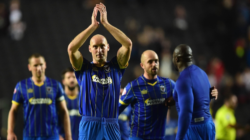 AFC Wimbledon celebrate at the final whistle
