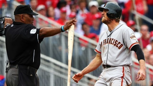Hunter Pence of the San Francisco Giants reacts after scoring on a single in the fourth inning against the Washington Nationals in the National League Division Series at Nationals Park in Washington