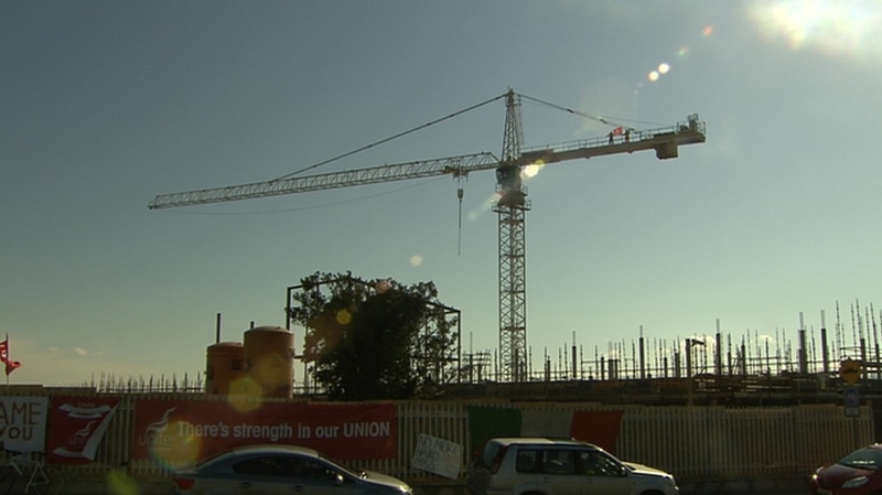 Two strikers are occupying a crane at the site