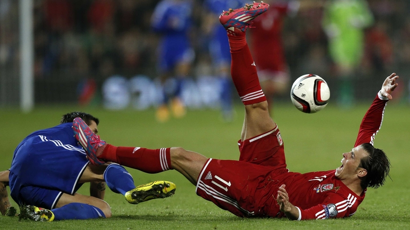 Wales' Gareth Bale vies for the ball with Bosnia-Herzegovina midfielder Muhamed Besic during the game