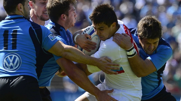 Russia's centre Mikhail Babaev is tackled during the run-off qualifier