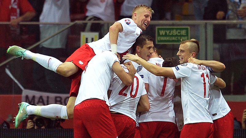 Poland's players celebrate after scoring the against Germany