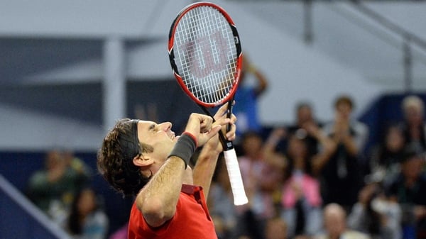 Roger Federer celebrates victory in Shanghai