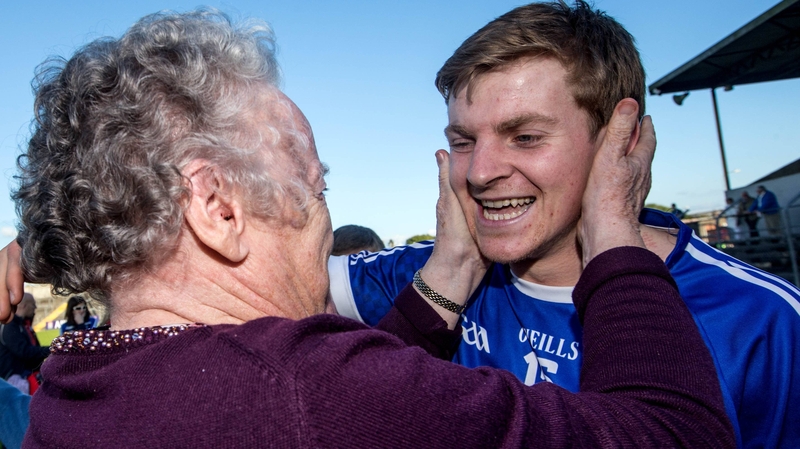 Cratloe's Padraic Collins celebrates with his grandmother Annette Collins after the game