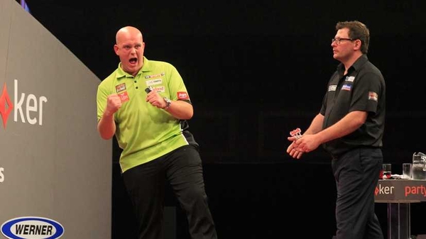 Michael van Gerwen full of cheer as James Wade looks on