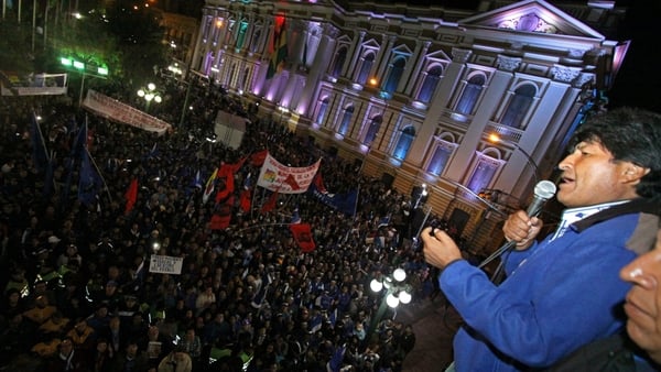 Evo Morales (R) celebrates his victory at the Government Palace in La Paz, Bolivia