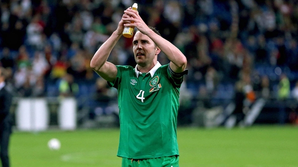 Goalscorer John O'Shea celebrates after the game