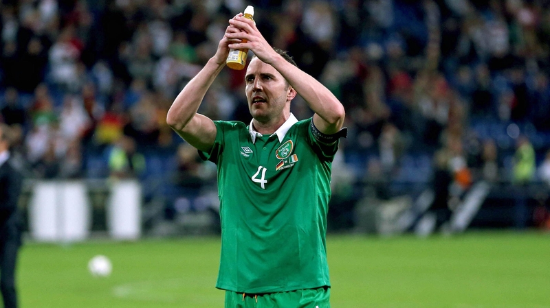 Goalscorer John O'Shea celebrates after the game
