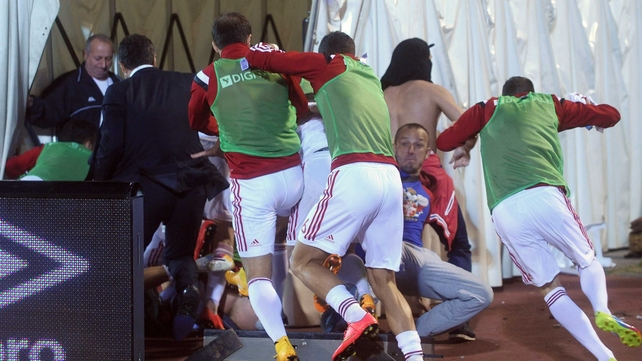 Albania players run for cover as the Euro 2016 qualifying match against Serbia is abandoned