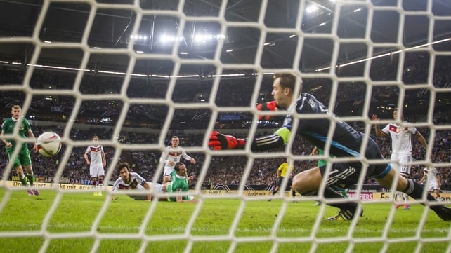 John O'Shea (c) scores past German goalkeeper Manuel Neuer