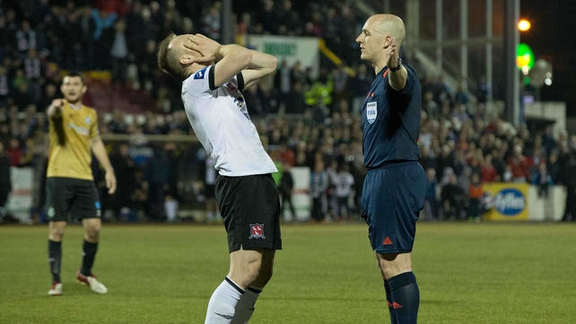 Dundalk's Stephen O'Donnell appeals for a handball decision from referee Rob Rogers during the clash with Shamrock Rovers