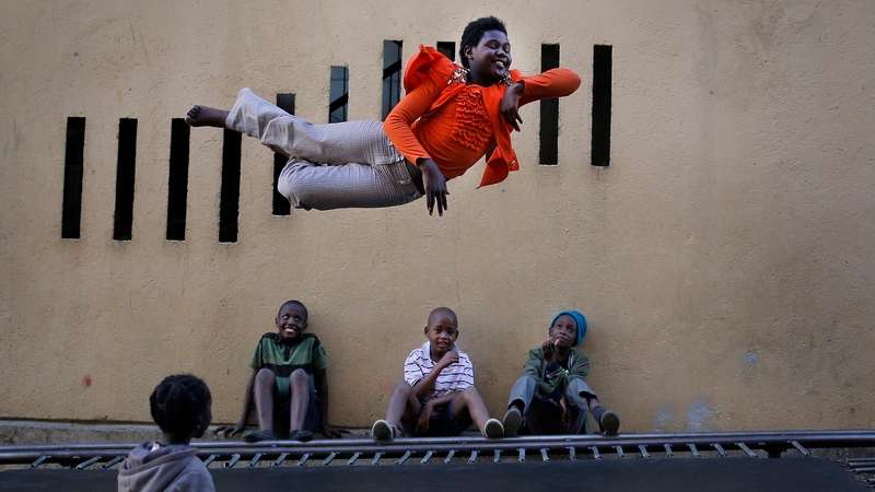 A girl jumps on a public trampoline in the Alexandra township of Johannesburg