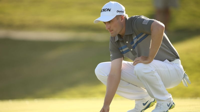 Russell Knox lines up a putt on the 16th green