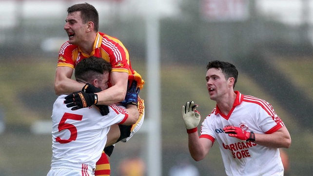 Ballintubber's Myles Kelly and Barry Moran of Castlebar Mitchels clash during the Mayo SFC final
