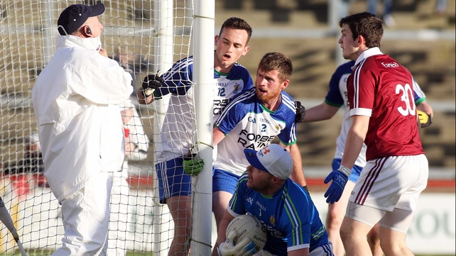 Ballinderry players confront the umpire over a goal during the Ballinderry vs Slaughtneil Derry SFC final...