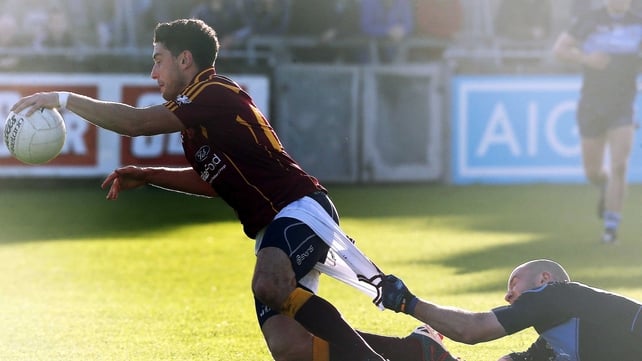 St Jude's Paul Cunningham tackles Bernard Brogan of St Oliver Plunkett's Eoghan Ruadh