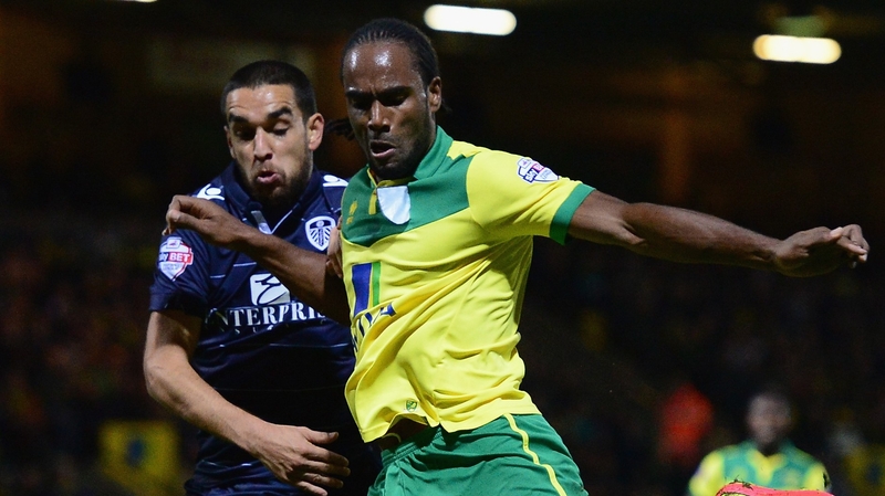 Giuseppe Bellusci of Leeds United battles with Norwich's Cameron Jerome
