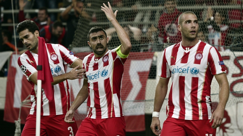 Olympiacos' Pajtim Kasami (r) after scoring against Juventus