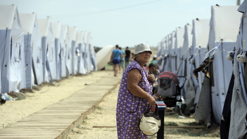 A refugee from eastern Ukraine walks in a refugee camp in Russia's Rostov region