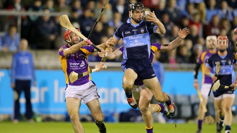 Danny Sutcliff of St Jude's gets there ahead of Crokes' Damien Kelly