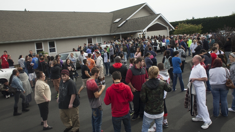 The Seattle Times reported that two students had died, and that four other people had been injured.