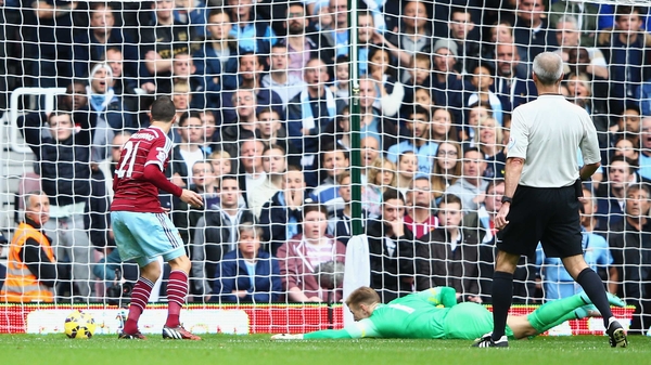 Morgan Amalfitano of West Ham United scores past Joe Hart