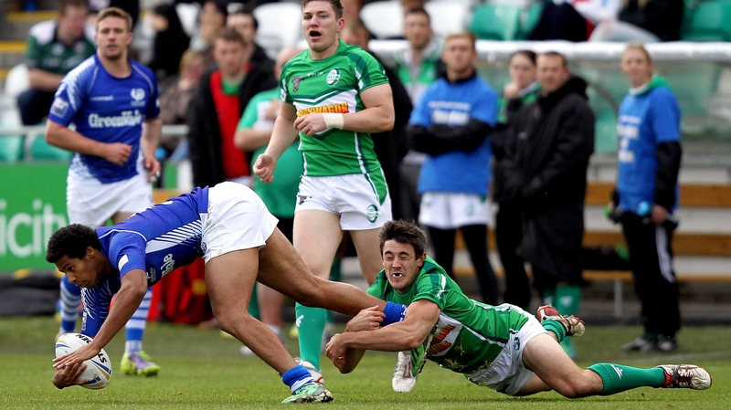 Scotland's Oscar Thomas is tackled by Josh Toole of Ireland