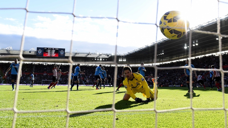 Asmir Begovic of Stoke City watches the ball cross the line as Sadio Mane of Southampton scores